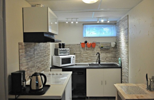 Cedarbrae Apartment | Private lower level suite with fireplace and a feeling of home