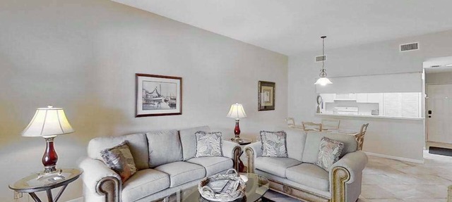 Gated resort community condo with water views, pool, hot tub, & balcony in Bonita Springs