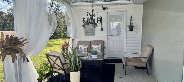 Modern studio apartment with covered outside seating area in Spring Hill