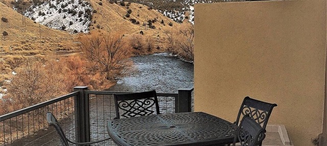 This riverfront downtown condo boasts and open floor plan for kitchen, living room, and dining areas. Or step onto the balcony over the Arkansas River to hear the water rushing by. Oversized master suite has its own balcony and indoor sitting area. in Salida
